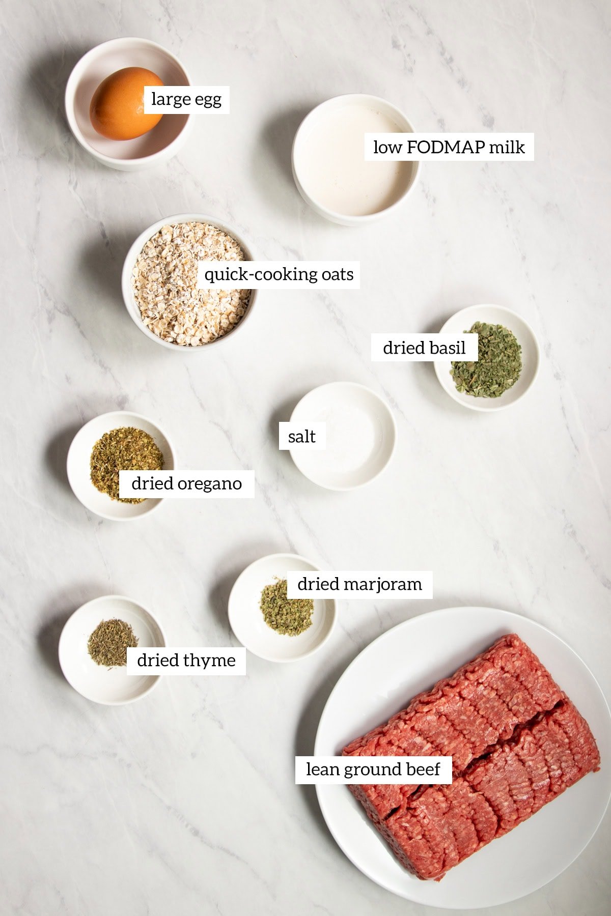 The ingredients needed to make Low FODMAP Italian Beef Meatballs are measured out into individual dishes ready for cooking.