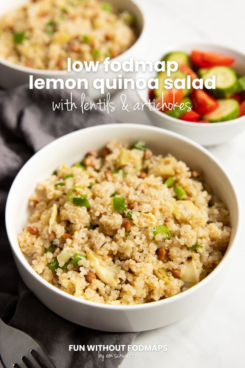 Three bowls on top of a white counter with a gray linen napkin in between. Two bowls have quinoa salad and one is filled with cucumbers and tomatoes. A white text overlay says "Low FODMAP Lemon Quinoa Salad with Lentils and Artichokes."
