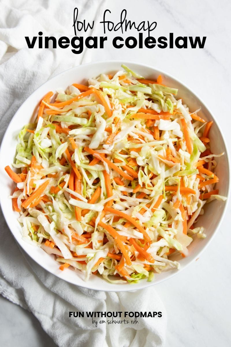 A bowl of coleslaw sits on a counter. In the white space above, black text reads "Low FODMAP Vinegar Coleslaw."