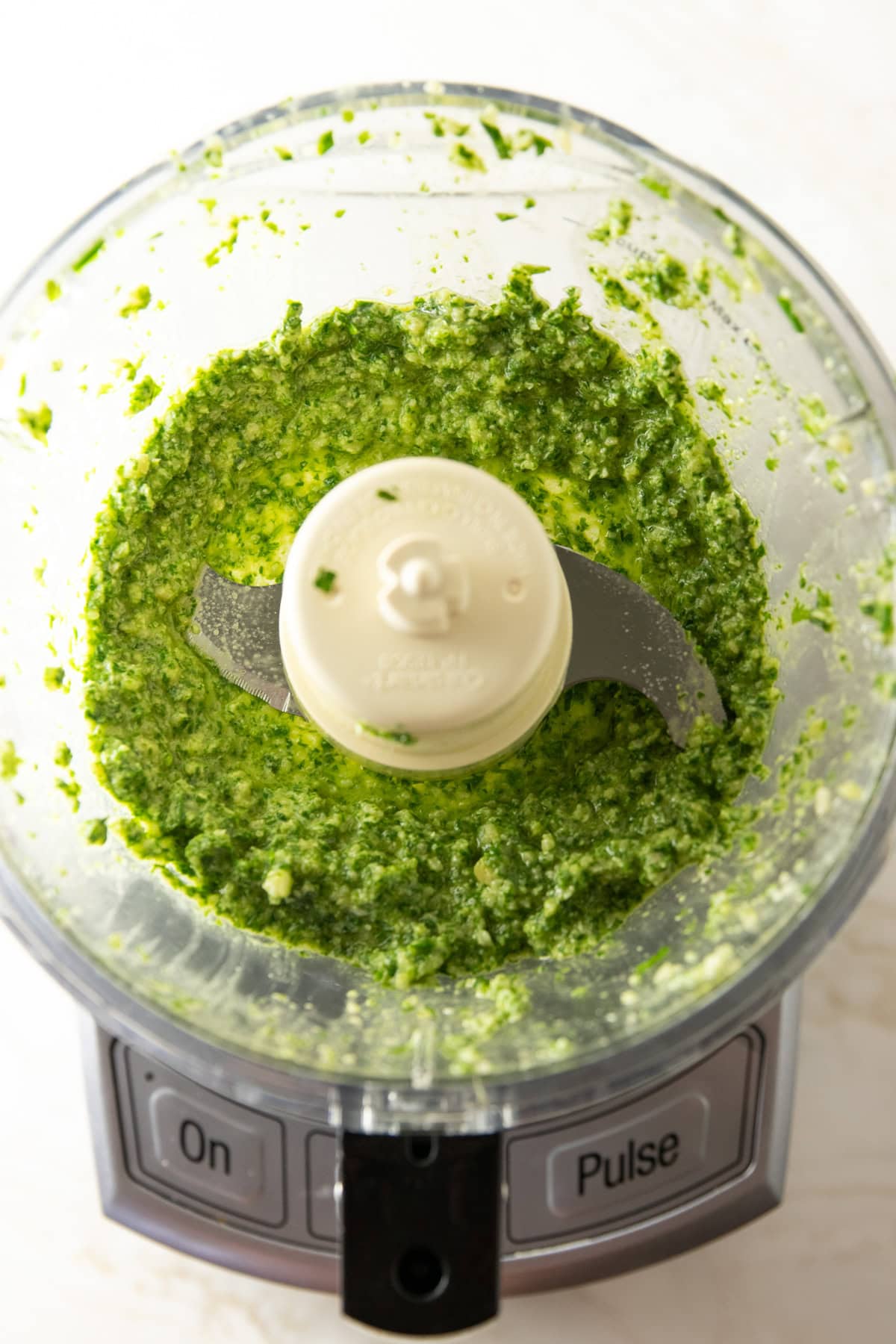 Chunky green sauce blended in a food processor.
